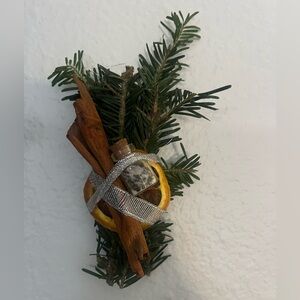 Handmade pine ornament with mini bottle for protection and abundance